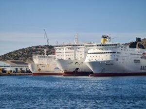 Cruise ship at Mediterranean port dock with ferry