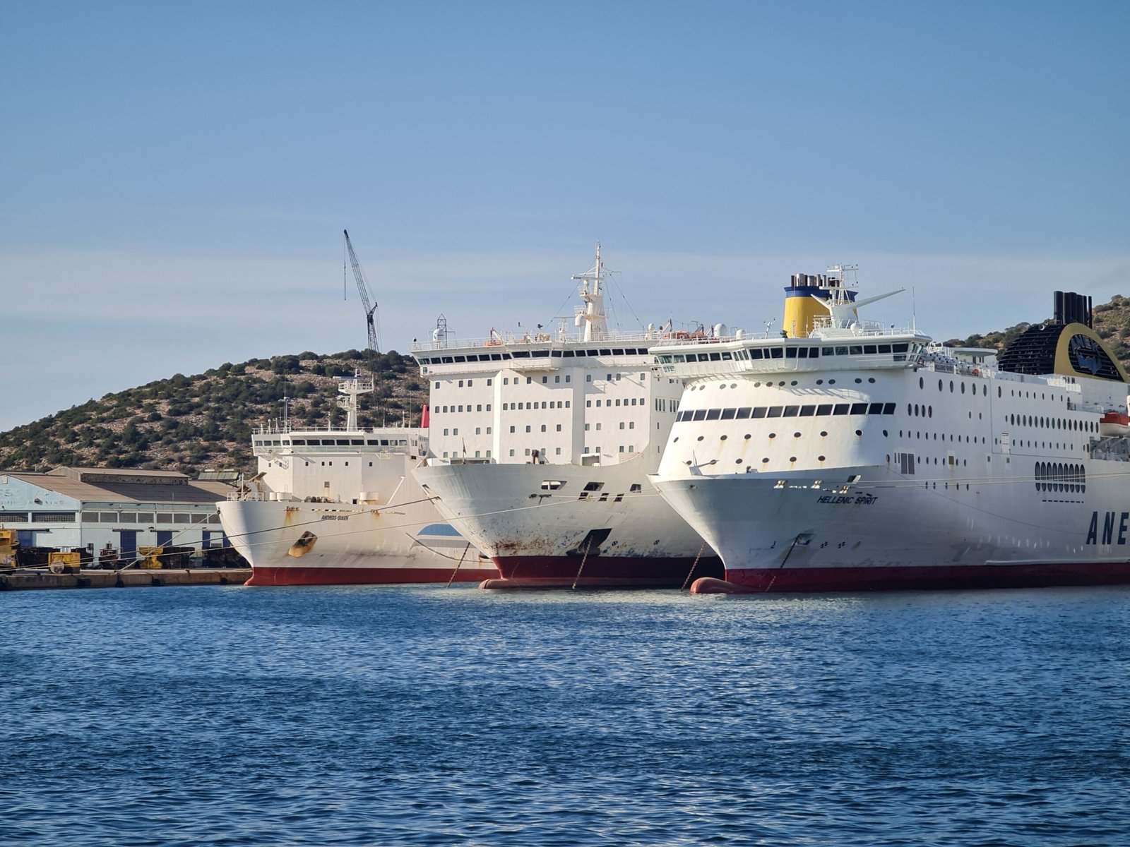 Cruise ship at Mediterranean port dock with ferry